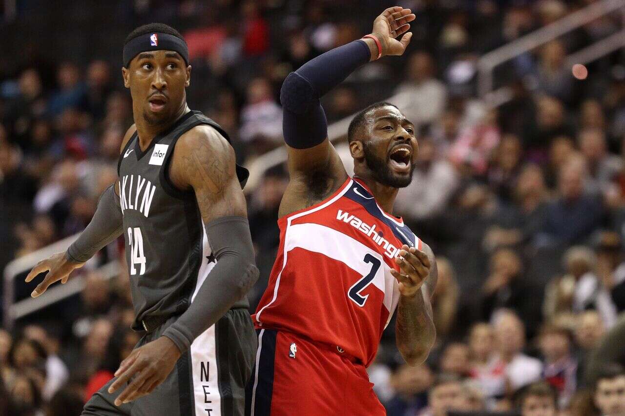 John Wall (右)的下一站到底在哪?法新社