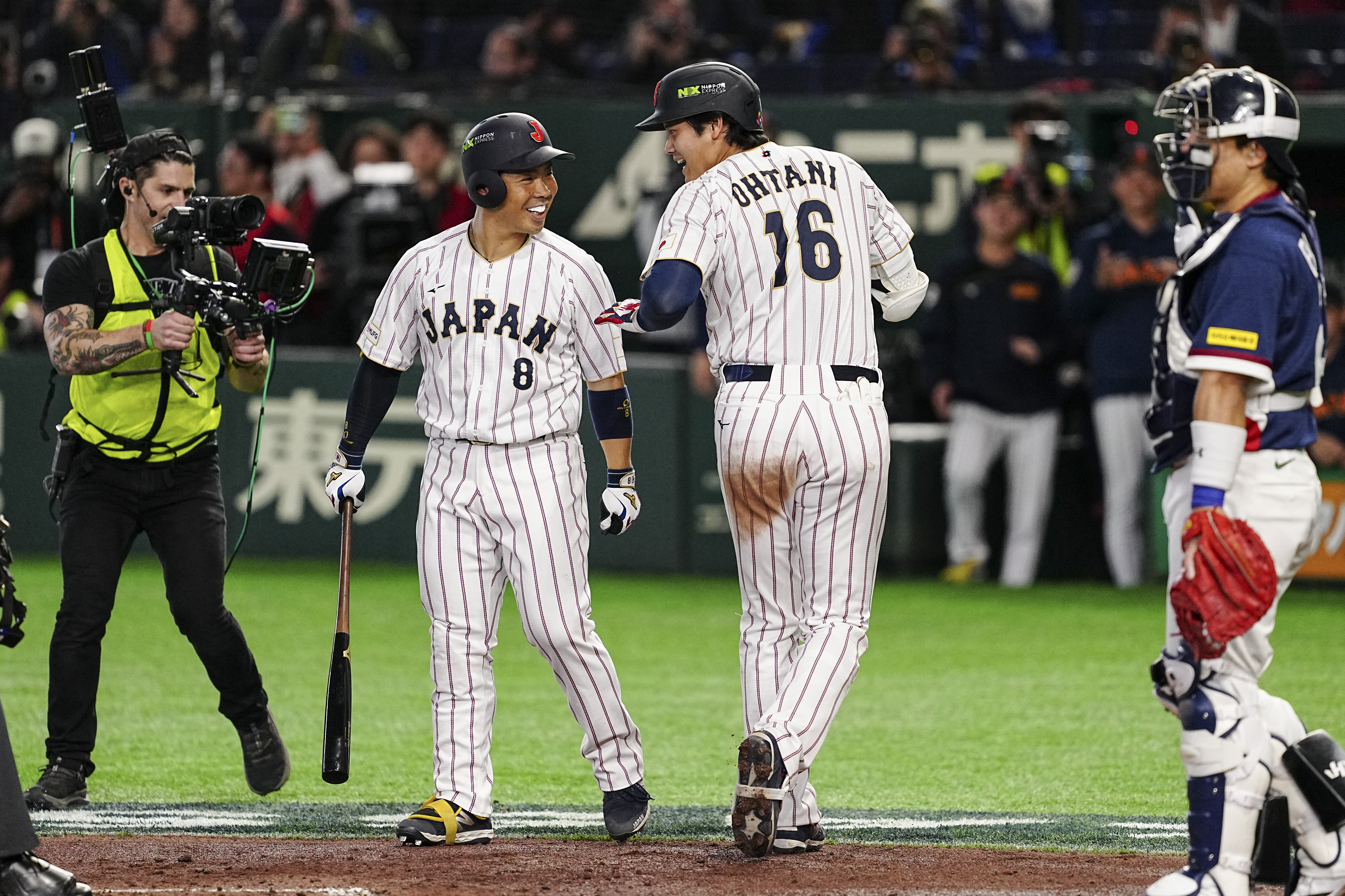 上屆賽會打擊相當出色的近藤健介(左)，這次參賽成績不盡理想，1支安打都沒有擊出。法新社