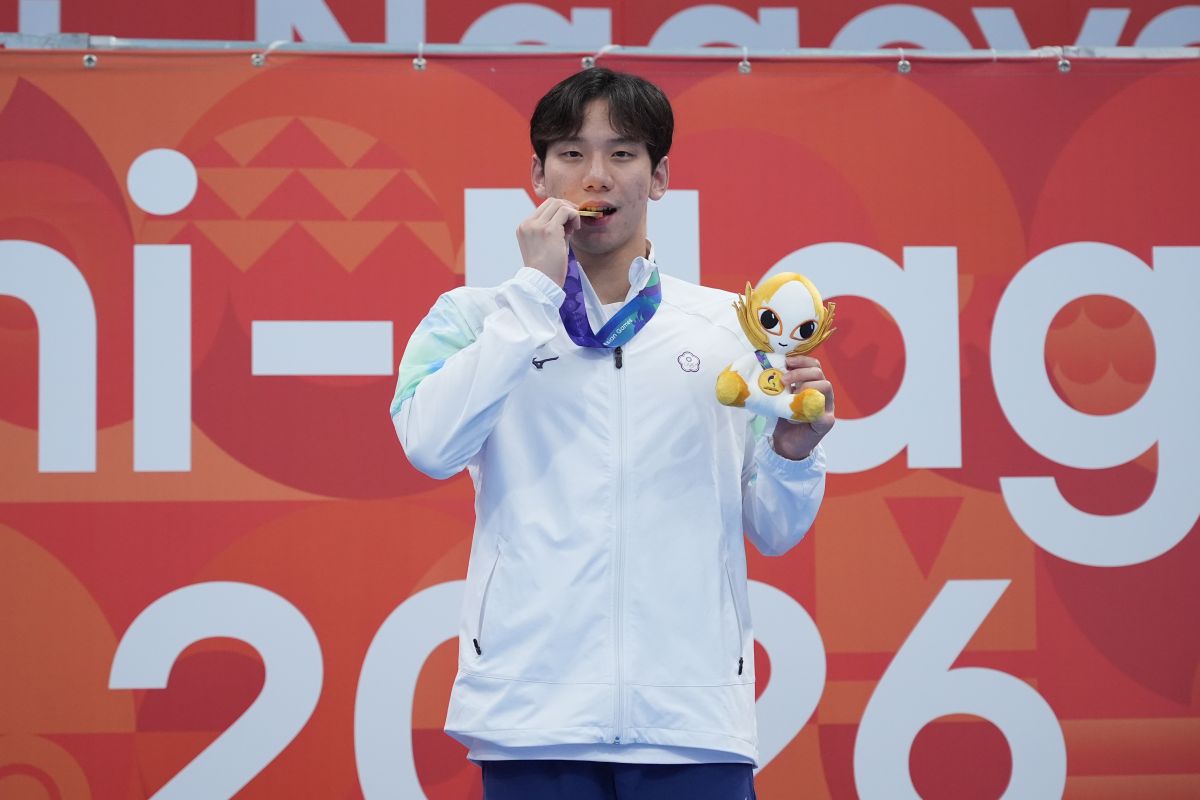 王冠閎帶傷為台灣拿下首面游泳亞運男子金牌。中華奧會提供