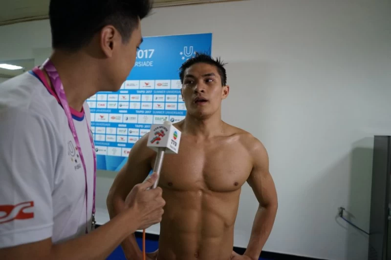 杜敬謙在臺北世大運接受香港TVB記者採訪。圖/台北世大運執委會提供