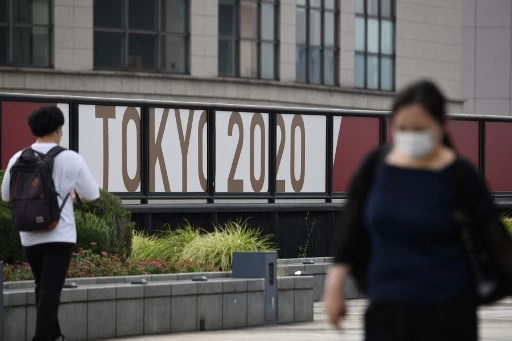 東京確診者居高不下。法新社