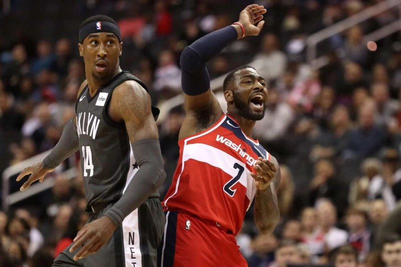 John Wall (右)的下一站到底在哪?法新社