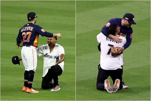 有位球迷不知從何處衝進場內,雙膝下跪熊抱「阿土伯」奧圖維(Jose Altuve)。摘自推特