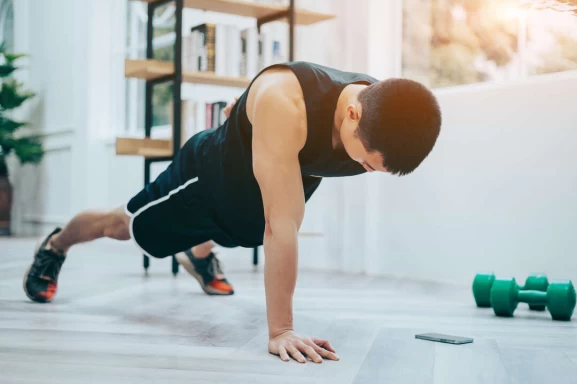 young asian man exercise home