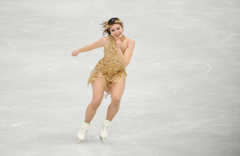 華裔花滑美女劉美賢奪金後真情流露。法新社