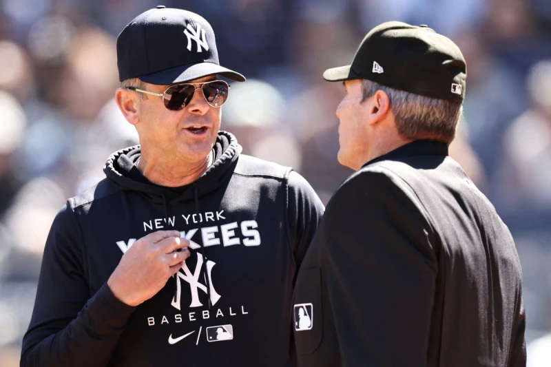 洋基教頭布恩(Aaron Boone,左)無緣見證尼克舉金盃。法新社